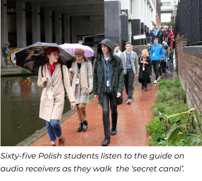 Sixty-five Polish students listen to the guide on audio receivers as they walk  the ‘secret canal’.
